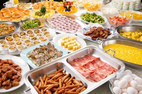 a buffet with many trays of different types of food at Main Hotel - Vacation STAY 82551 in Miyakonozyō