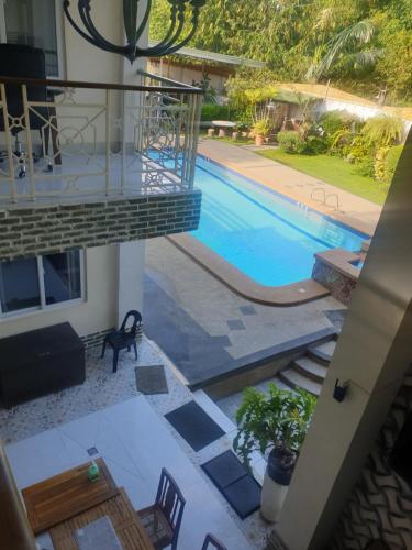 an overhead view of a swimming pool in a house at Elicon Suites in Tagbilaran City