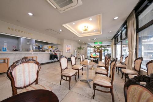 a restaurant with chairs and a table and a counter at Main Hotel - Vacation STAY 82546 in Miyakonozyō
