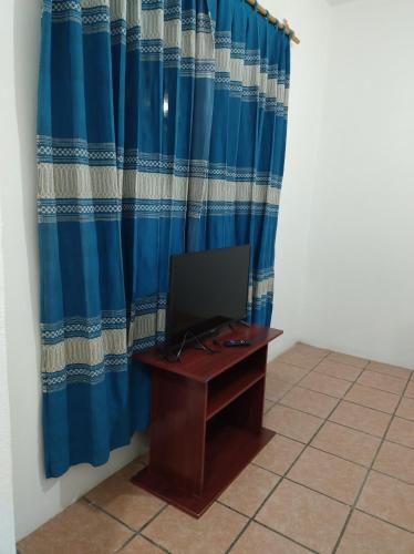 Televisyen dan/atau pusat hiburan di Casa Vacacional La Arcada