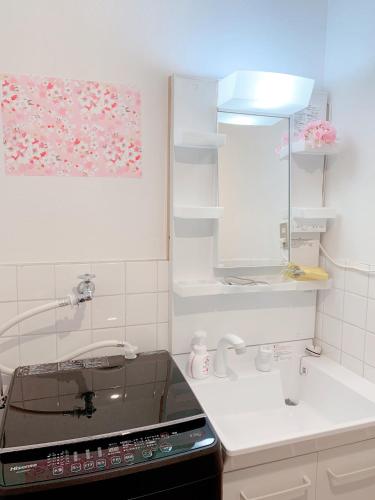 a kitchen with a sink and a counter top at ヴィラ 奈良 with gift 小さなギフト付 奈良駅から15から20分 in Nara