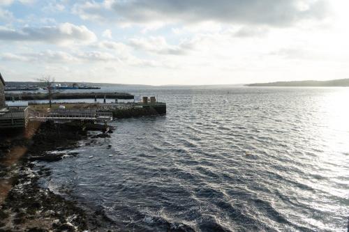 a view of a body of water with a dock at Albert's in Shelburne