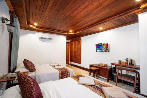 Ένα ή περισσότερα κρεβάτια σε δωμάτιο στο P5 Angkor Residence