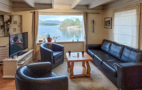 a living room with a couch and two chairs and a table at Gorgeous Home In Jrpeland With Kitchen in Jørpeland