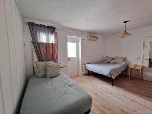 En eller flere senger på et rom på Porthos, bonito apartamento zona Puerta del Ángel