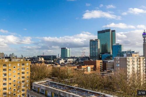 a view of a city with tall buildings at Penthouse Studio by Regent's Park/Euston in London