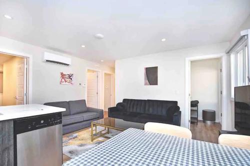 a living room with a couch and a table at Beautiful 4-BDR in Heart of Plateau Mont-Royal in Montréal