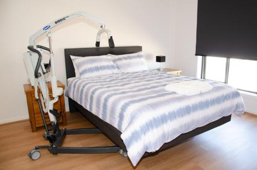 Ένα ή περισσότερα κρεβάτια σε δωμάτιο στο G&G Accessible Lifestyle @ 5