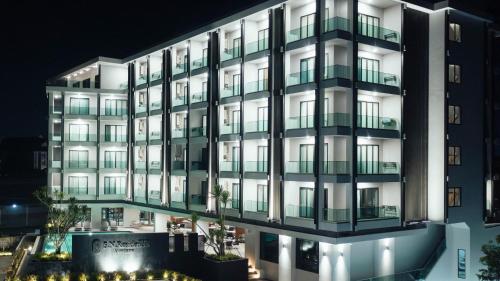 a rendering of a building at night at SN Residences in Vientiane