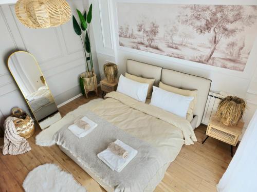 a bedroom with a bed and a mirror at Premium , Marina , Center , Beachfront in Durrës