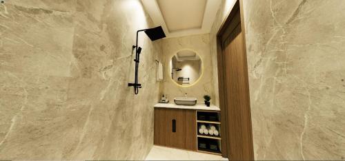 a bathroom with a sink and a mirror at Hotel Shakuntla Grand in Gaya