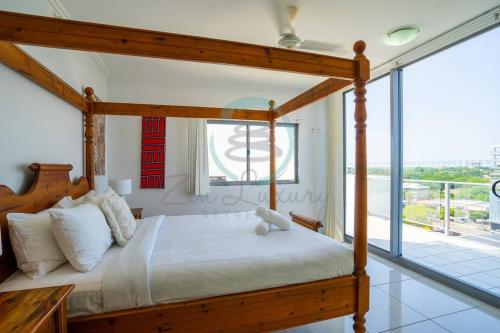 Katil atau katil-katil dalam bilik di Zen at Mitchell - Unique 2-BR Rooftop Apt in CBD