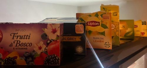 a bunch of boxes of food sitting on a shelf at Auberge La Veranda in Luxembourg