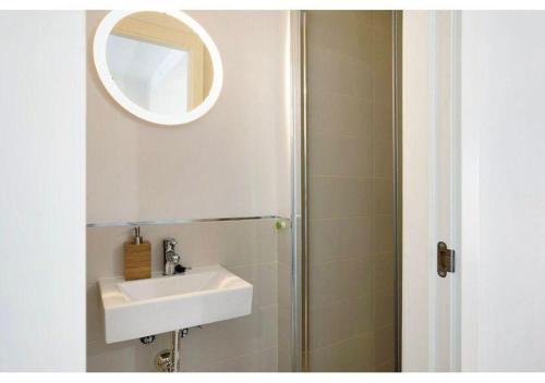 a bathroom with a sink and a mirror at Paraíso zahara in Zahara de los Atunes