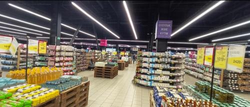 a large grocery store aisle with a lot of products at 2 комнатная квартира 4 in Almaty