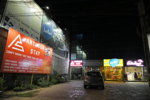 a car parked in a parking lot in a building at Anyhour Stay in Gannavaram