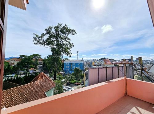 a balcony with a view of a city at Villa Pink House in Da Lat