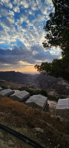 a view of a hill with a view of a valley at Dana Village lodge and Camp-Wadi Dana Eco camp in Dana