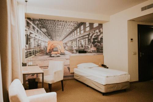 a hotel room with a mural of a room at Iness Hotel in Łódź
