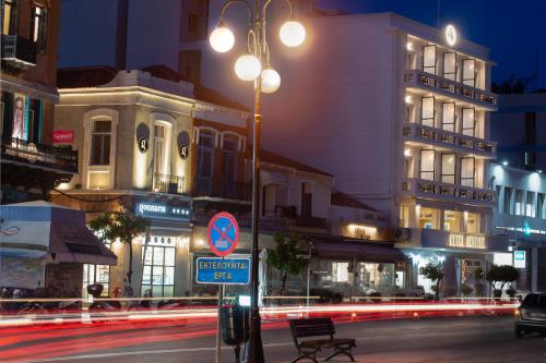 a street at night with a street light and buildings at Lesvion Hotel in Mytilene