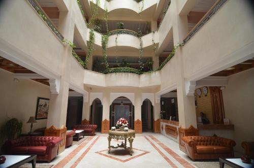 a large lobby with couches and a table at Golden Beach Appart'hotel in Agadir