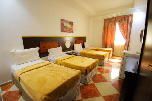 En eller flere senger på et rom på فندق ربا الحجاز