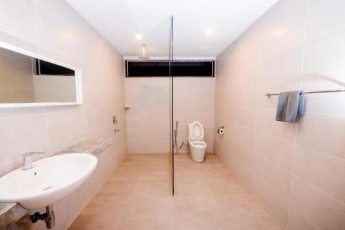 a bathroom with a sink and a toilet at Rebungan Resort Langkawi in Kuah