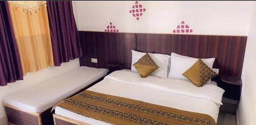 Postel nebo postele na pokoji v ubytování Brilliant Sunny Resort