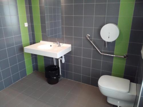 a bathroom with a sink and a toilet at Cap Verb Guillestre in Guillestre