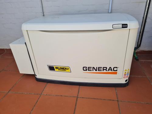 a white cooler sitting on a tile floor at Fairview Guesthouse in Ballito