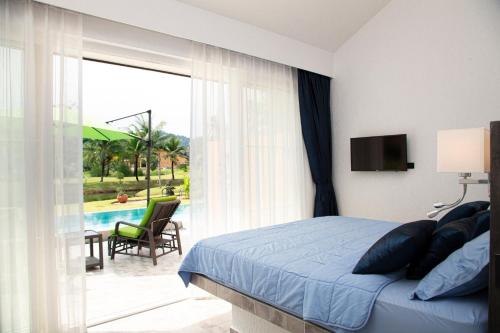 Postel nebo postele na pokoji v ubytování Villa Manao - Koh Chang