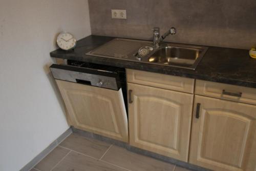 a kitchen with a sink and a counter top at Neu! FeWo Lahnblick 1 