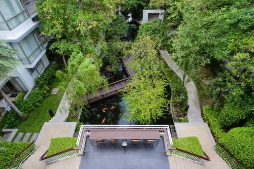 an overhead view of a bridge over a river at The Park Nine Hotel Srinakarin in Bangkok