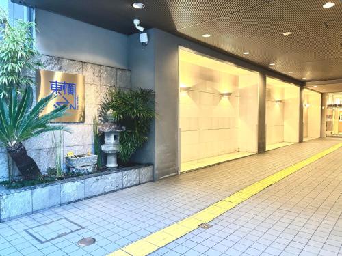 a lobby of a building with plants on the wall at Toyoko Inn Kyoto Shijo-omiya in Kyoto