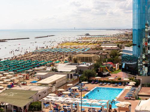 an aerial view of a beach and a pool at Hotel Tokio Village in Lido di Savio