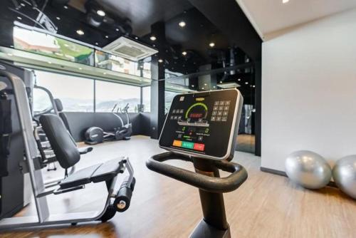 a gym with a cell phone on a treadmill at Best Western Hotel Rocca in Cassino