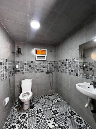 a bathroom with a toilet and a sink at Riad Palais D'Or in Rabat