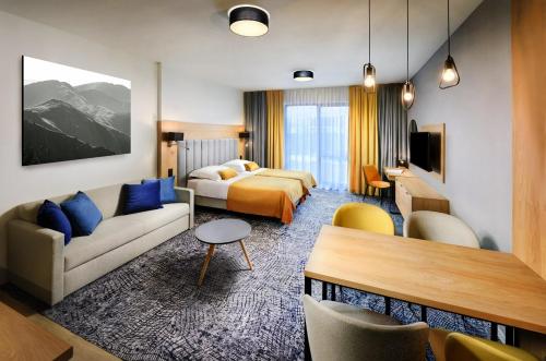 TV a/nebo společenská místnost v ubytování Hotel Akvamarín