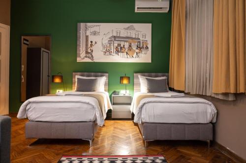 Postel nebo postele na pokoji v ubytování Hotel London B&B