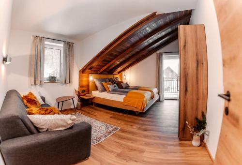 Postel nebo postele na pokoji v ubytování Bergmoment Apartments