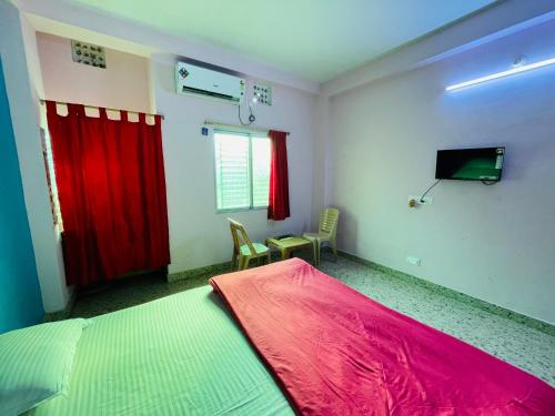 Voodi või voodid majutusasutuse Sefali Beach Inn ! Puri - ViDi Group toas