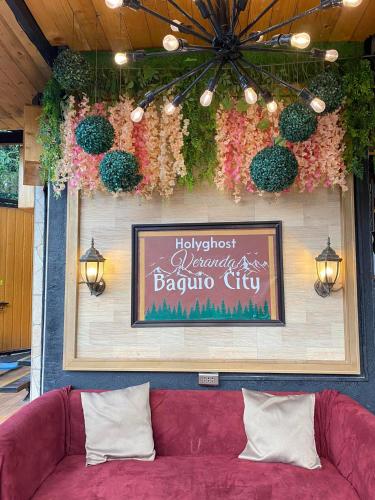 a wall with a sign that says happyost margarita barula city at Holyghost Veranda Baguio Transient Guest House 42 step rooftop in Baguio