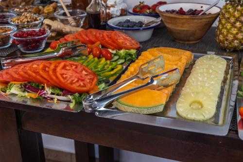 a tray filled with different types of food on a table at B&B Plitvice Queen in Plitvička Jezera