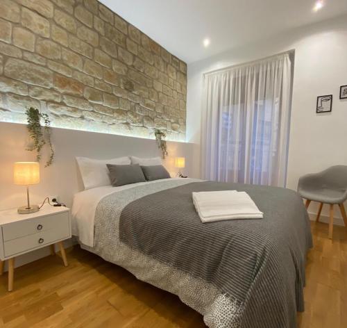 מיטה או מיטות בחדר ב-Apartamento Esencia San Vicente de la Sonsierra