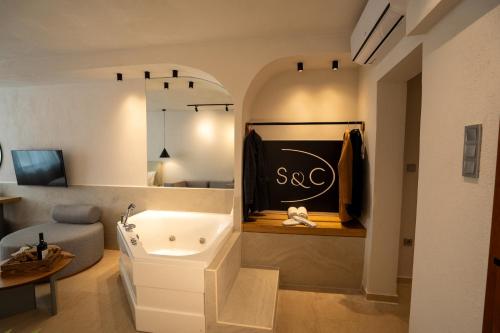 a dressing room with a sink and a mirror at Sea & the City in Thessaloniki