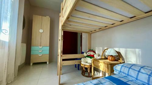 a bedroom with a bunk bed and a desk at MEDDAYS VILLA AMPARO in Miami Platja