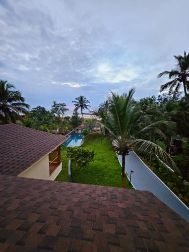 a view from the roof of a house with a swimming pool at Savera Seafront in Suratakal