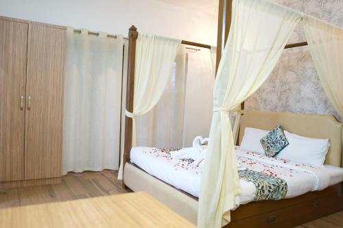 Postel nebo postele na pokoji v ubytování Larios Beach Holidays