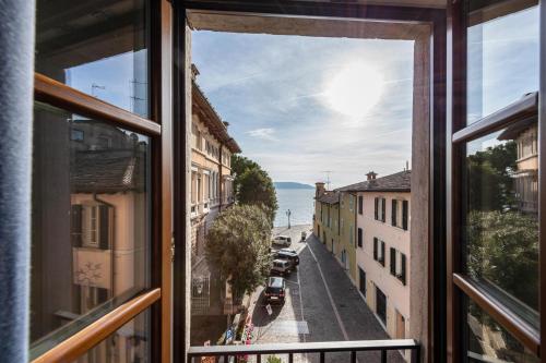 a view of a street from a window at Gemhouse Turchese garda lake in Gargnano