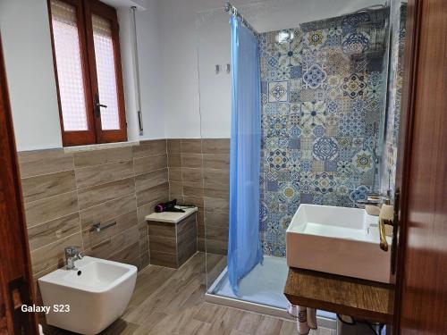 a bathroom with a shower and a sink at BAGLIO SUL MARE Letojanni Taormina in Letojanni